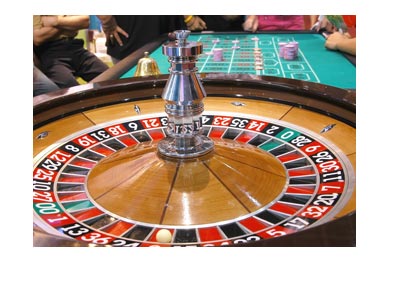 Live casino roulette table shot from the dealer side / angle.