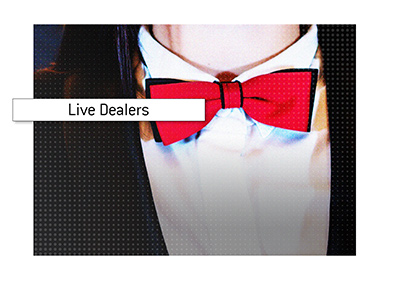 Live casino dealer wearing a red bow tie.